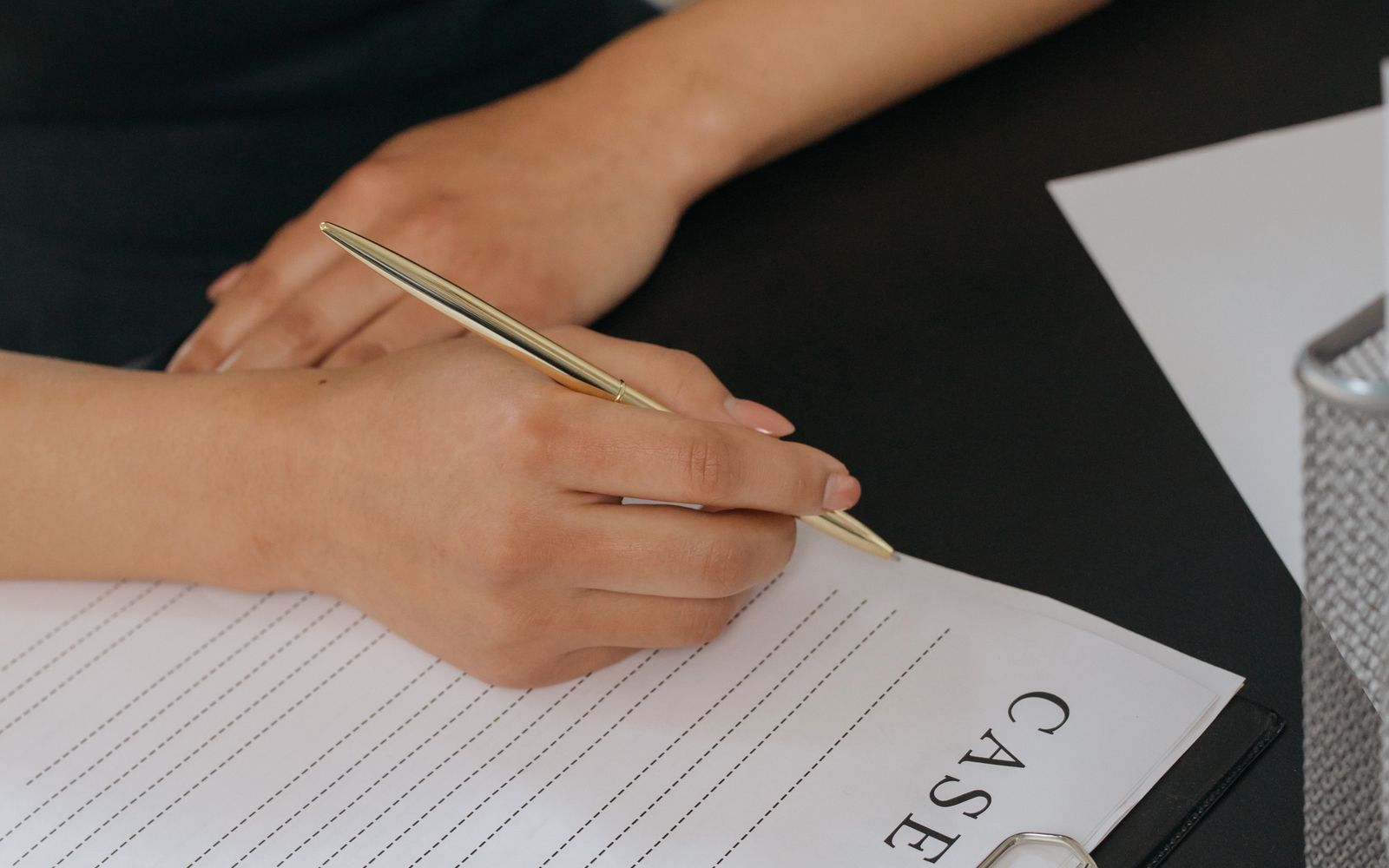 Signing a stack of property paperwork
